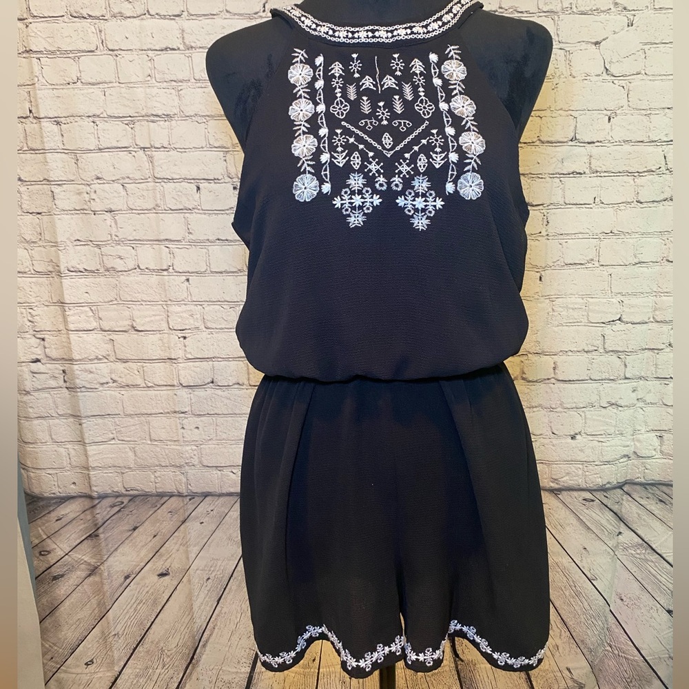 Three pink hearts. Black and white romper size large.
